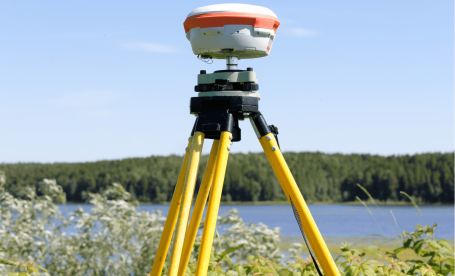 GNSS on a tripod in a natural setting.